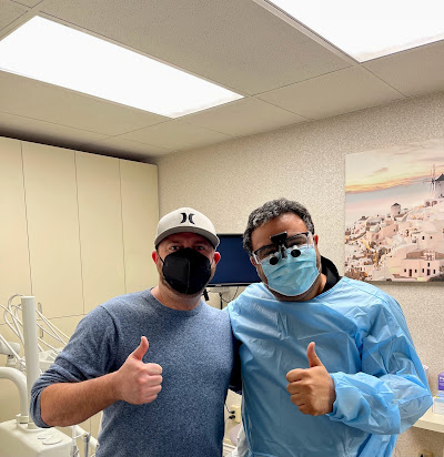 Dr. George Mirsal with patient after emergency dental treatment in Huntington Beach