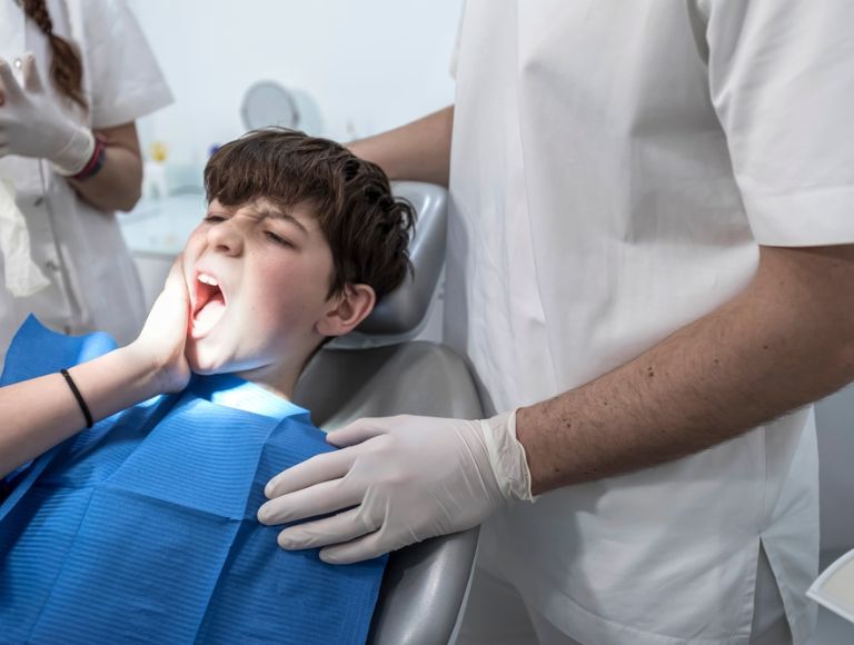 Patient undergoing emergency dental treatment in Huntington Beach