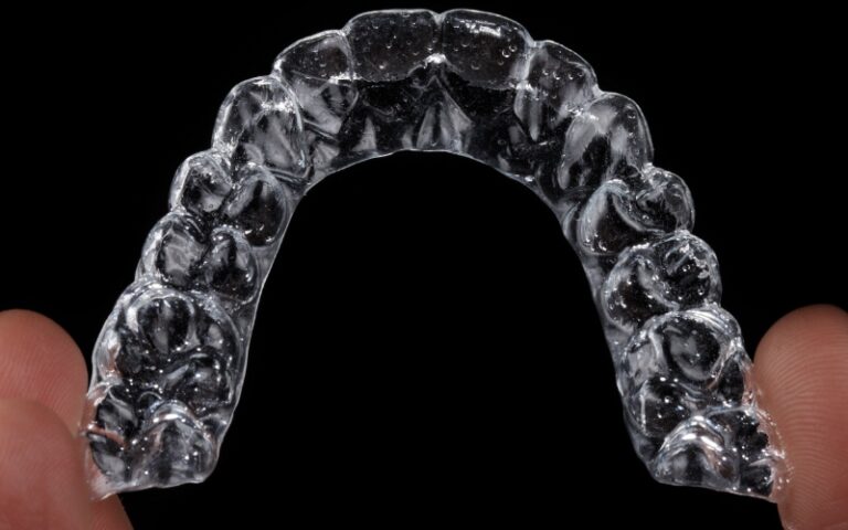 Close-up of clear aligner showing proper care and cleanliness