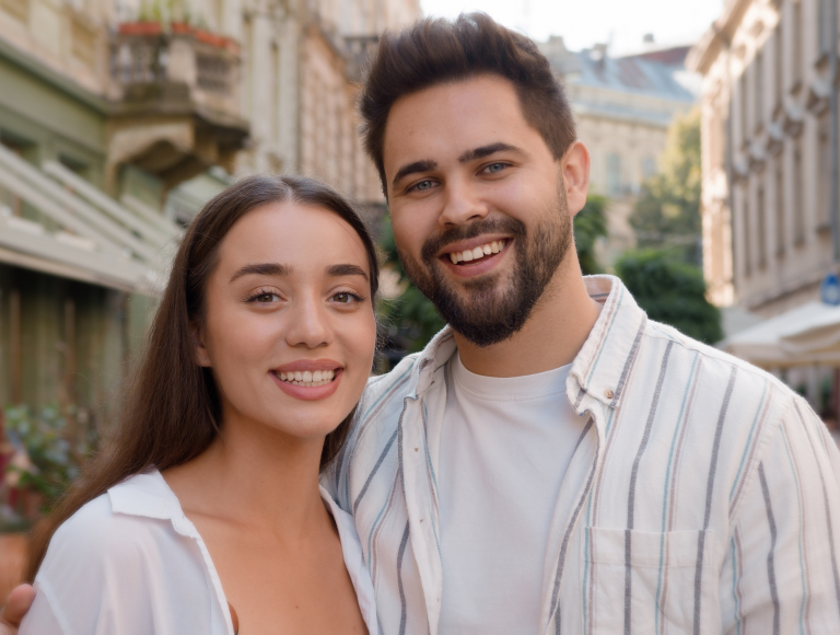 Smiling couple after dental bonding in Huntington Beach