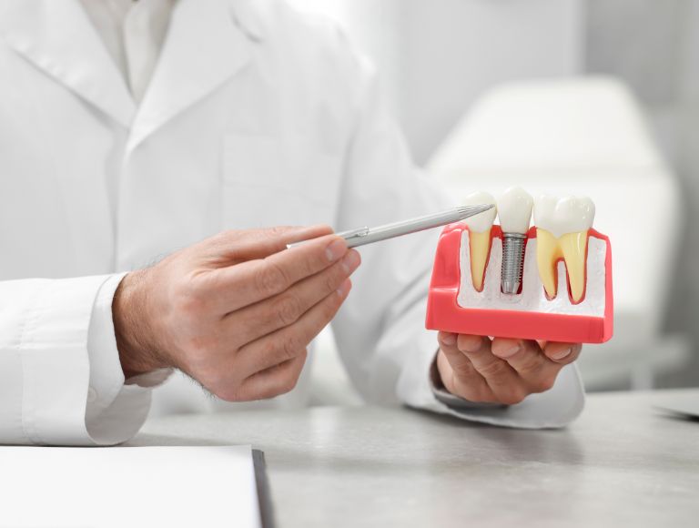 dentist discussing dental implants with patient in huntington beach