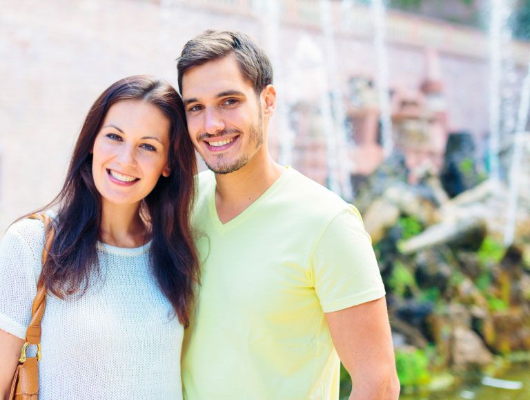 happy couple after dental crowns treatment in huntington beach
