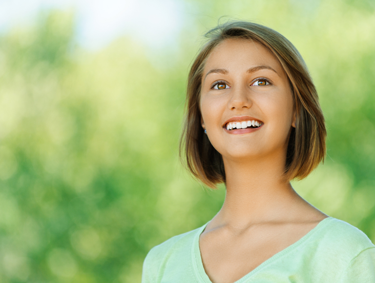 happy woman after successful root canal therapy in huntinton beach