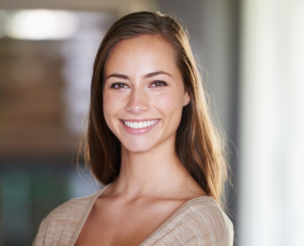 Smiling lady after receiving cosmetic dental treatments in Huntington Beach