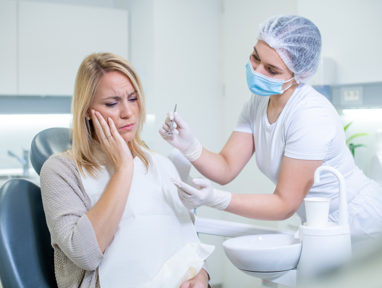 dentist consulting a patient before wisdom teeth removal in huntington beach
