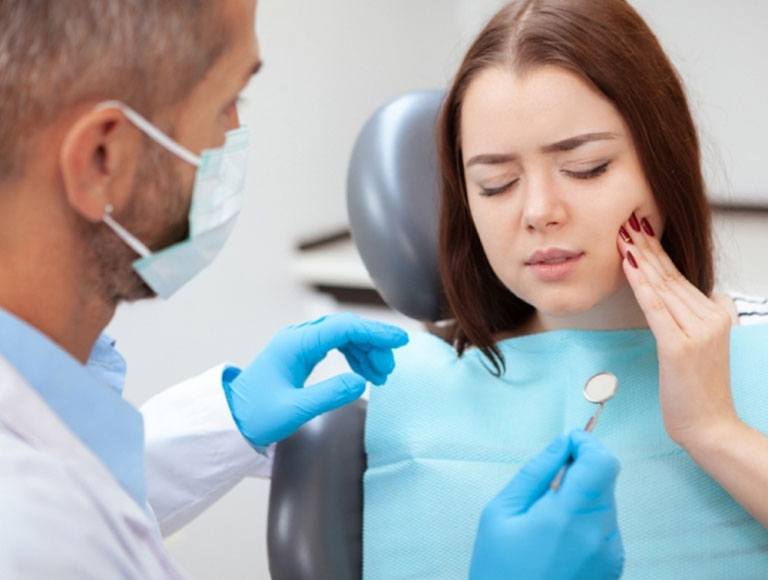 Patient receiving TMJ treatment in Huntington Beach dental office